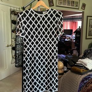 This beautiful black and white hand beaded semi formal dress designed by Conover